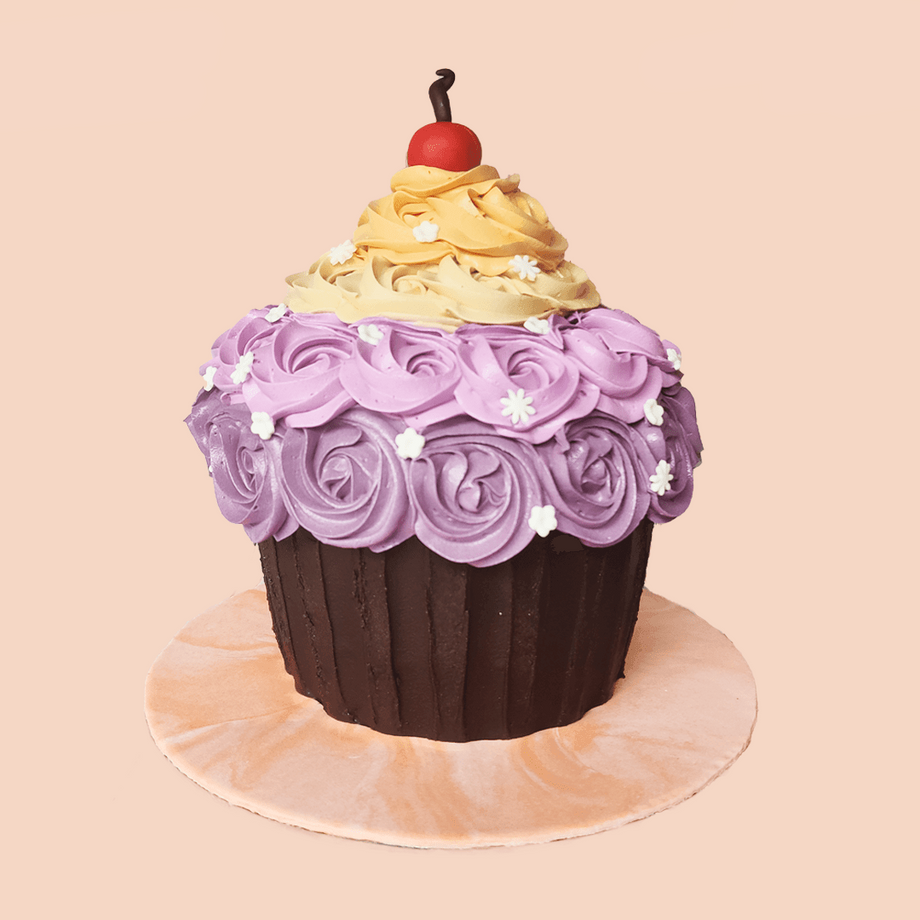 https://www.cravebyleena.com/cdn/shop/products/purple-giant-cupcake-cake-crave-by-leena_460x@2x.png?v=1703144735